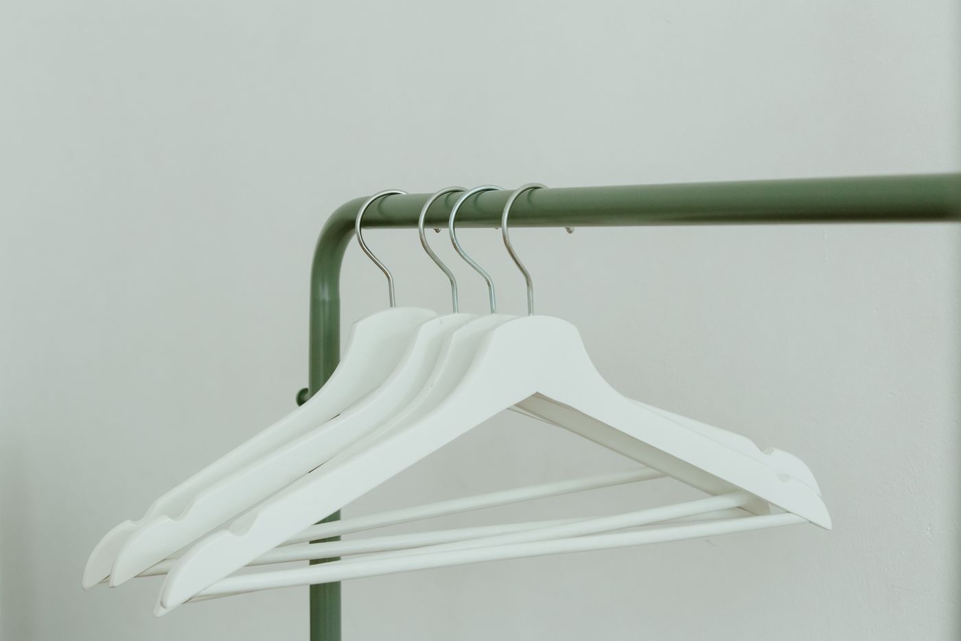 Clean garments arranged on a modern clothing rack