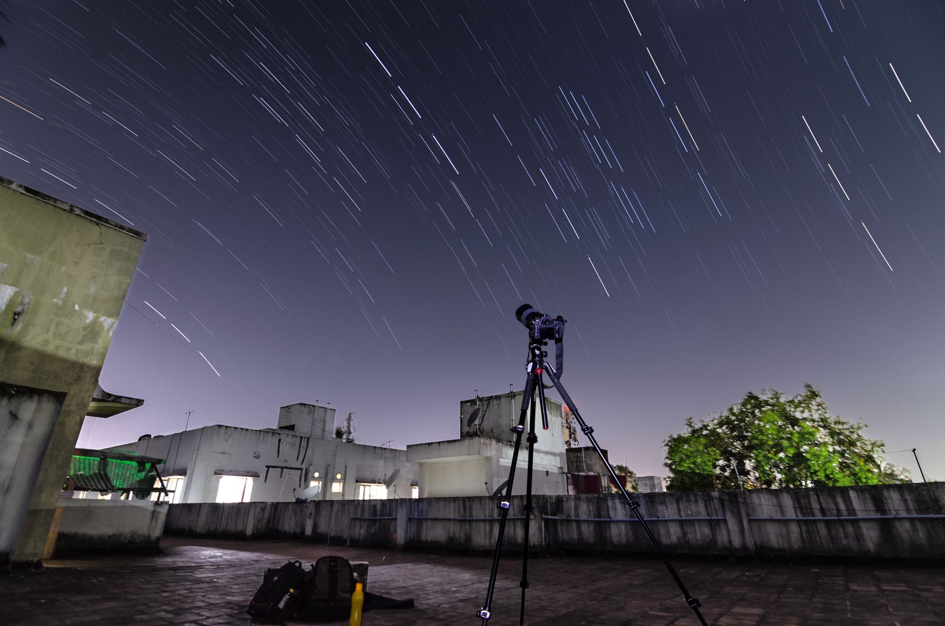 A telescope observing a star-filled night sky