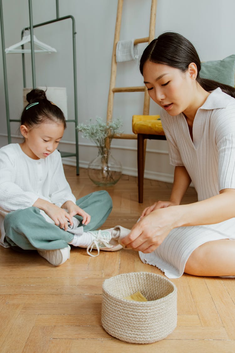 Mother And Daughter Organizing Together