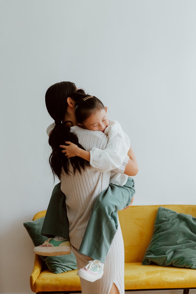 Woman Hugging Daughter