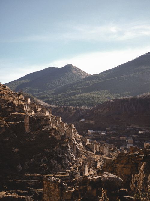 Free Serene view of ancient ruins in Dagestan, Russia with mountainous backdrop. Stock Photo