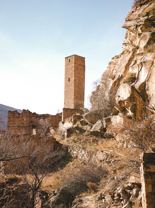 Free Explore the ancient tower ruins nestled in the rocky mountainsides of Dagestan, Russia. Stock Photo