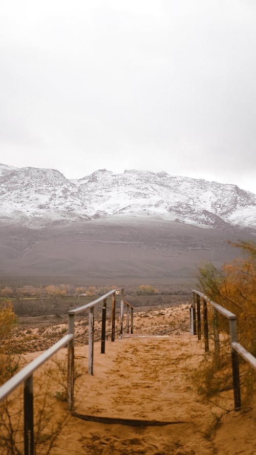 Pathway Near a Snow Covered Mountain