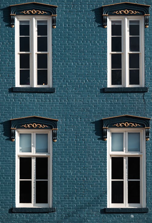 Blue Brick Walled Building with Windows