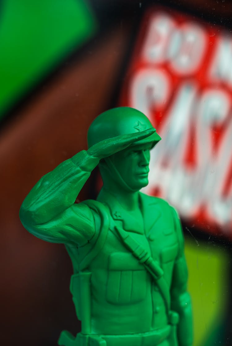 Green Toy Soldier In Close-up Photography