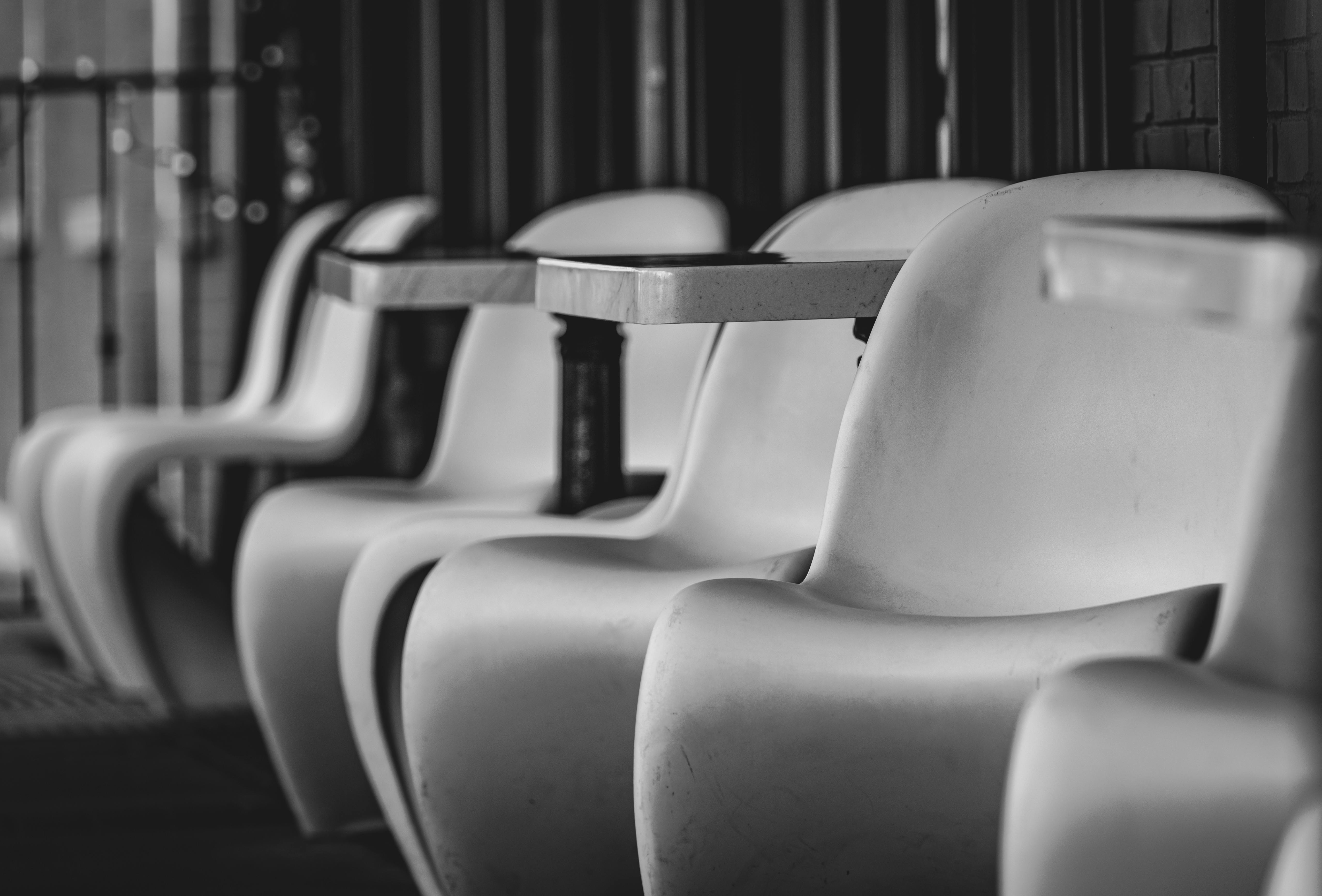 Grayscale Photo of an Empty Chair · Free Stock Photo