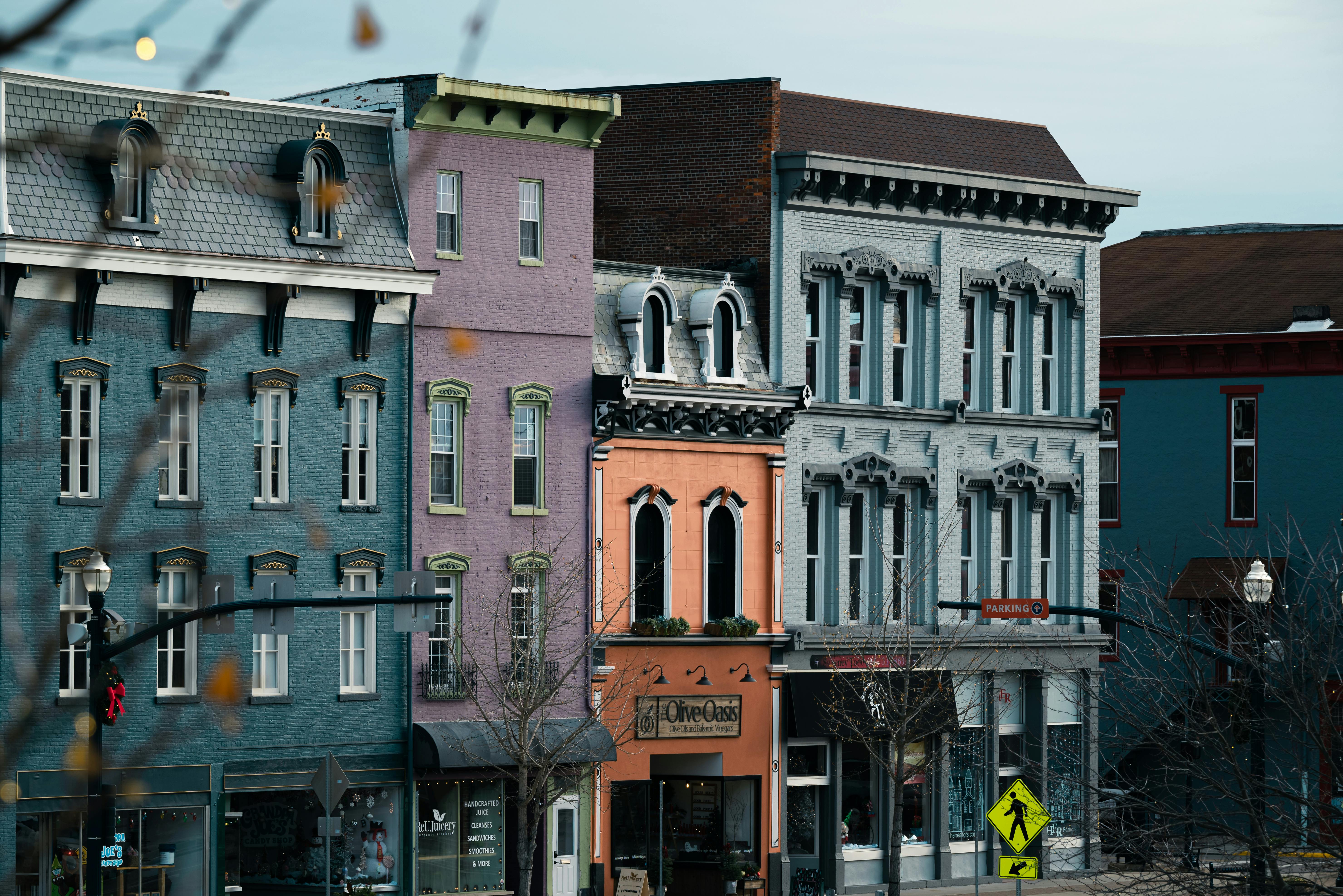 Vibrant row of historic buildings featuring unique architecture in an urban area.
