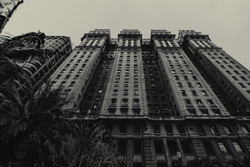 Grayscale Photo of a High Rise Building