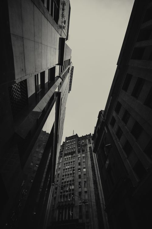 Free Low angle shot of towering skyscrapers in monochrome, capturing architectural grandeur. Stock Photo