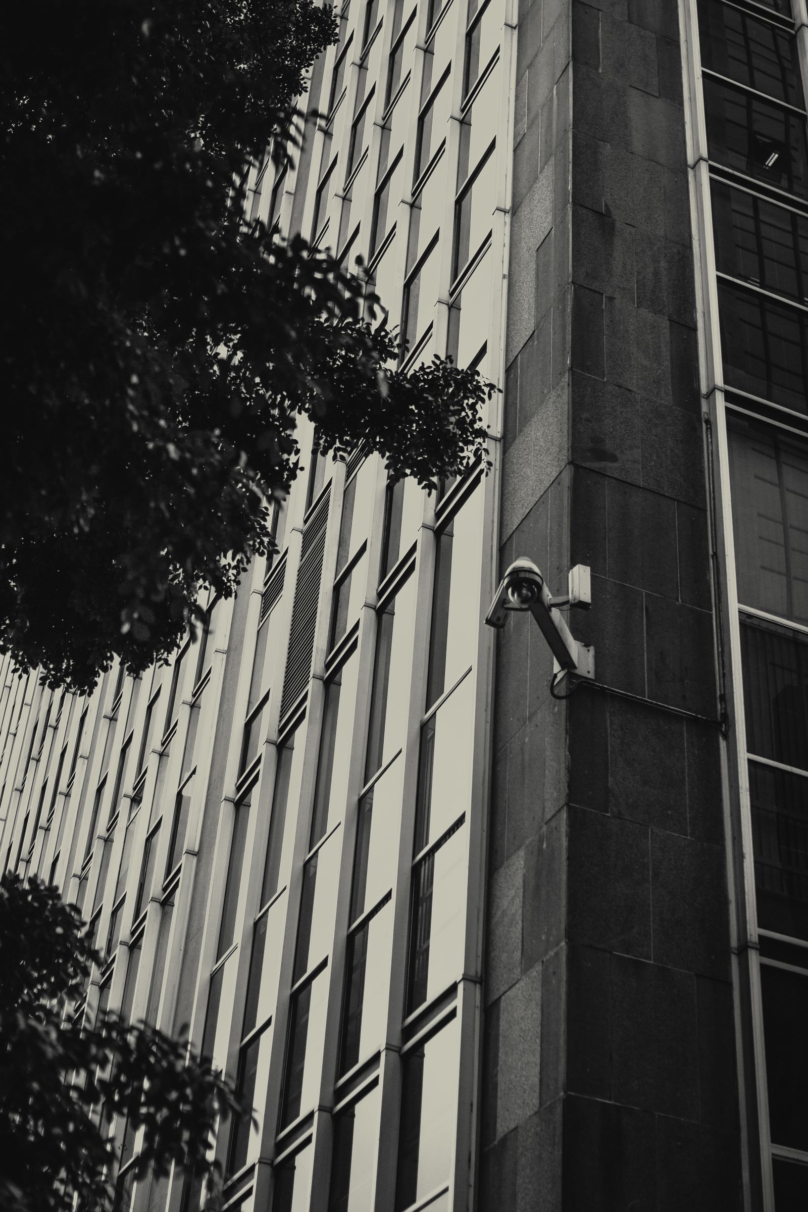 Security camera mounted on a modern commercial building