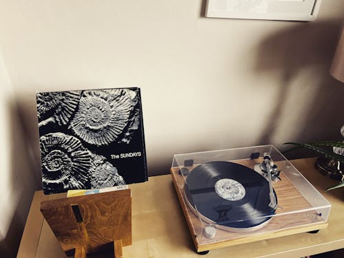 A Vinyl Record on a Wooden Table