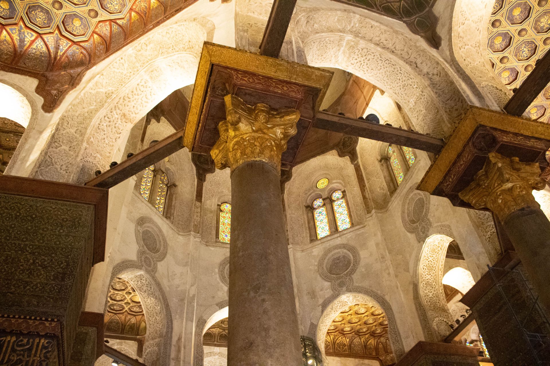 Detailed view of ornate Islamic architecture inside a historic mosque in Cairo, Egypt.