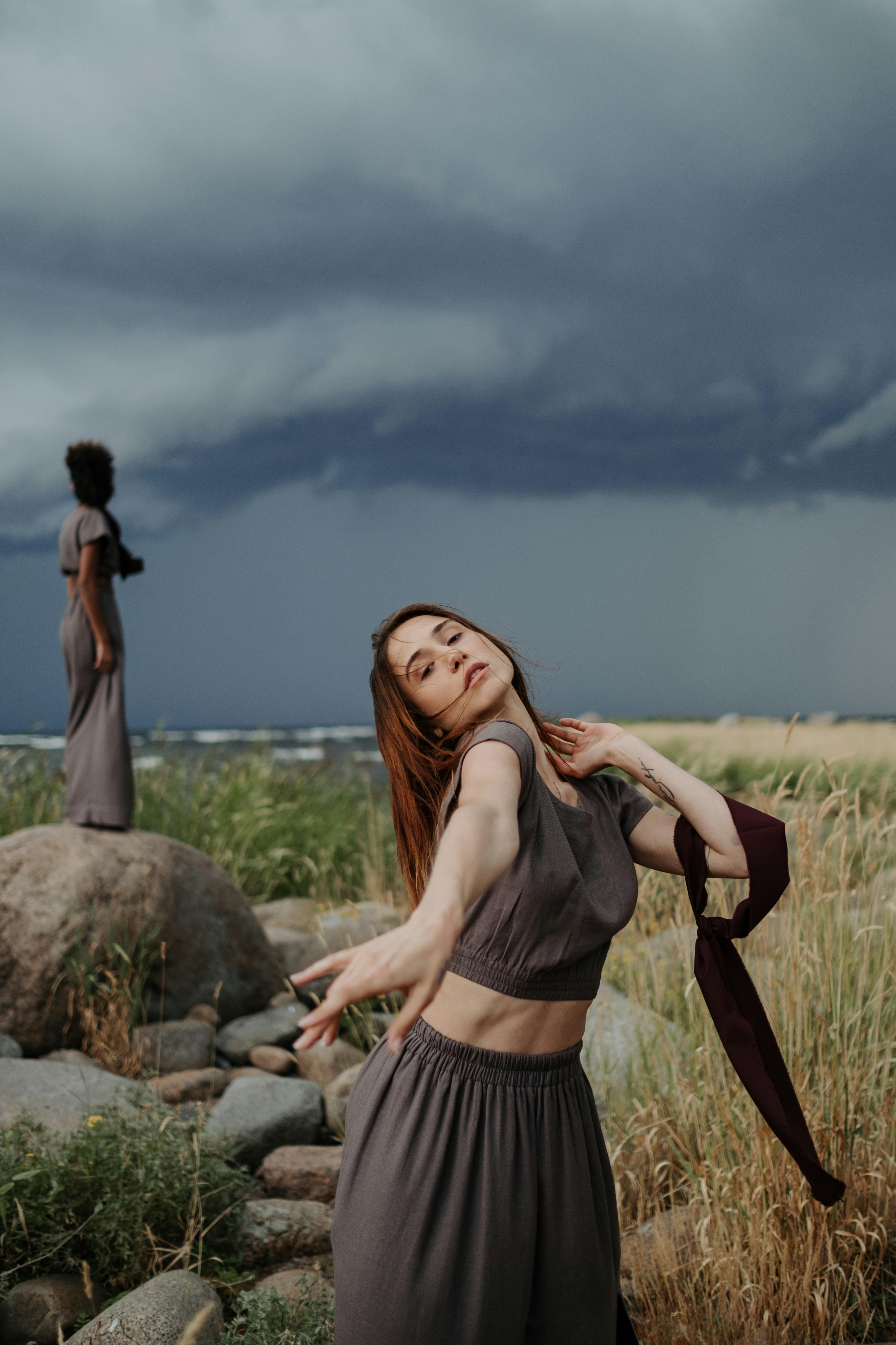 Woman in Gray Crop Top Dancing on Saeshore · Free Stock Photo