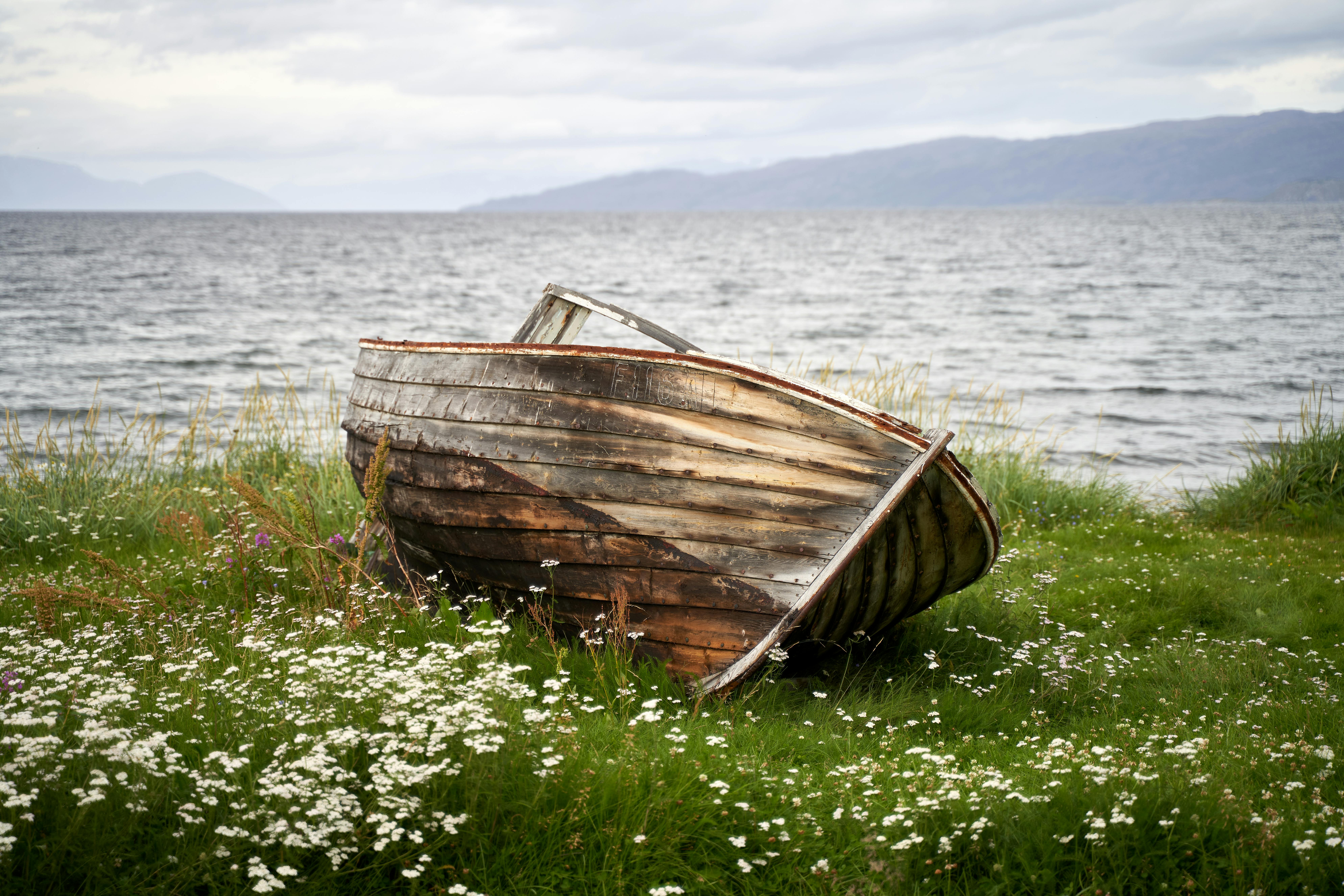 An Old Wooden Boat Near a River · Free Stock Photo
