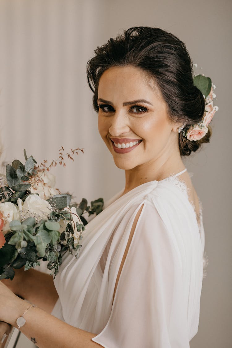 Bride In White Dress And Updo Holding Bouquet