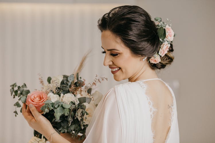 Bride In White Dress And Updo Holding Bouquet