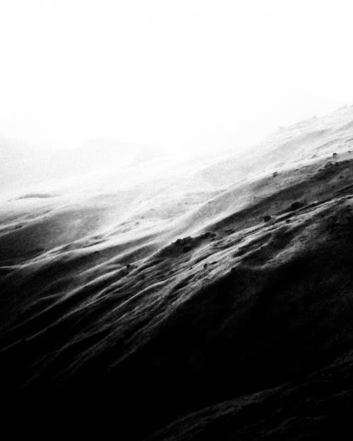 Grayscale Photo of Mountains