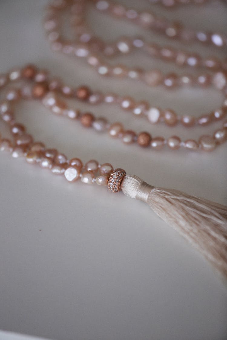 Close-up Of A String With Pink Pearls 