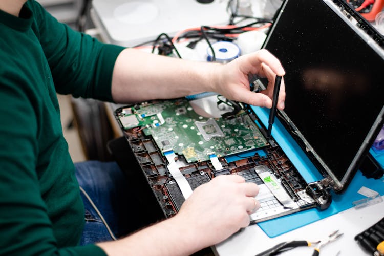 Man Repairing Laptop