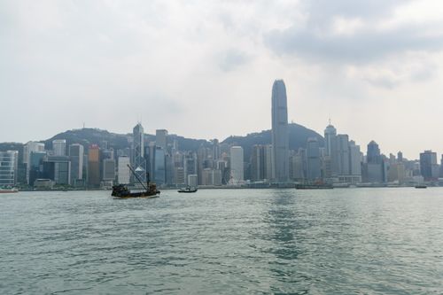 Free Stunning Hong Kong skyline view across Victoria Harbour with traditional junk boat Stock Photo