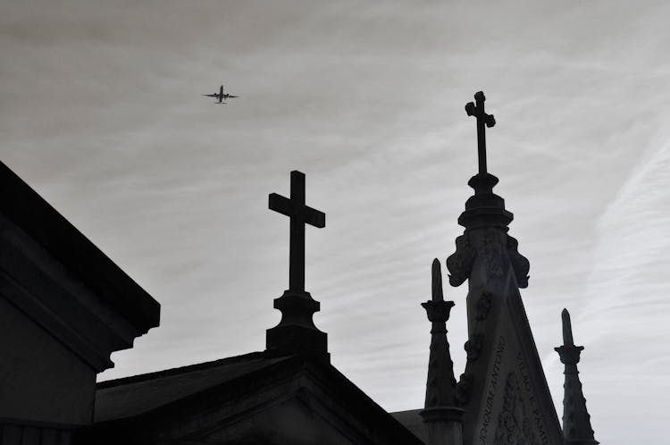 An Airplane Above A Church