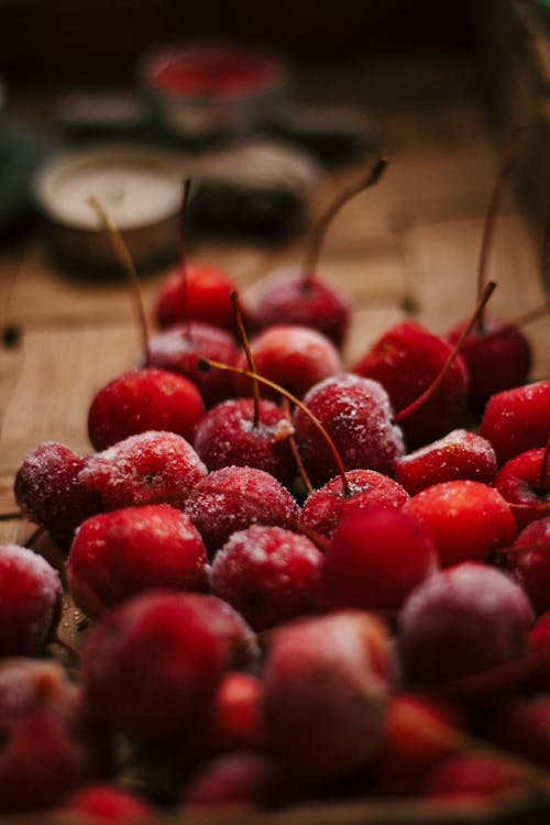 Frozen Cherries on a Wooden Surface