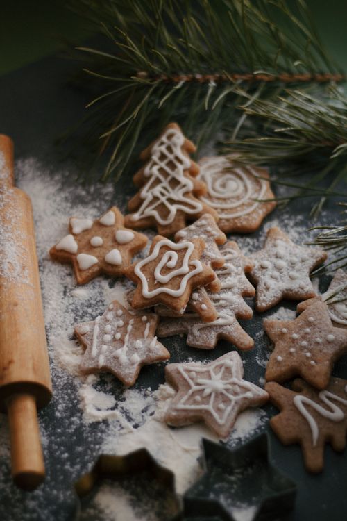 Free Beautifully decorated gingerbread cookies with pine branches and rolling pin. Stock Photo