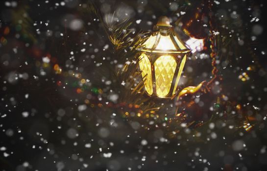 A glowing lantern amidst gently falling snow, creating a magical winter ambiance with sparkling lights.