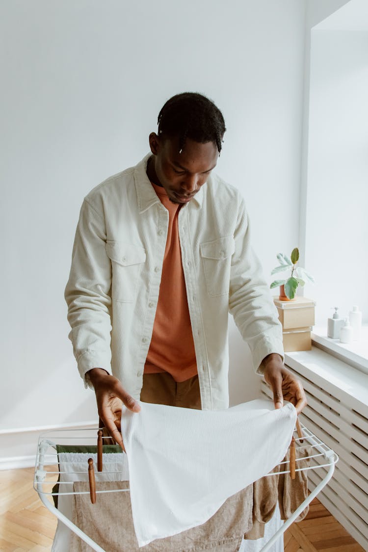 Man Hanging Laundry To Dry