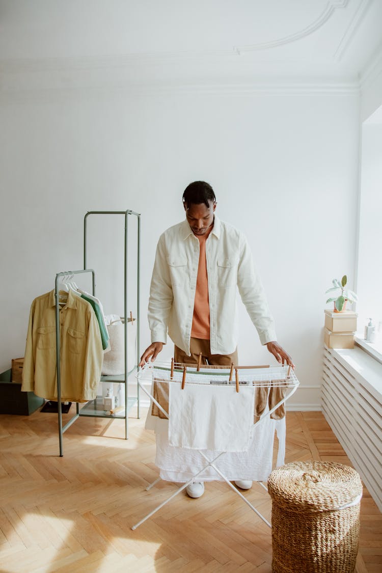 Man Hanging Clean Laundry To Dry