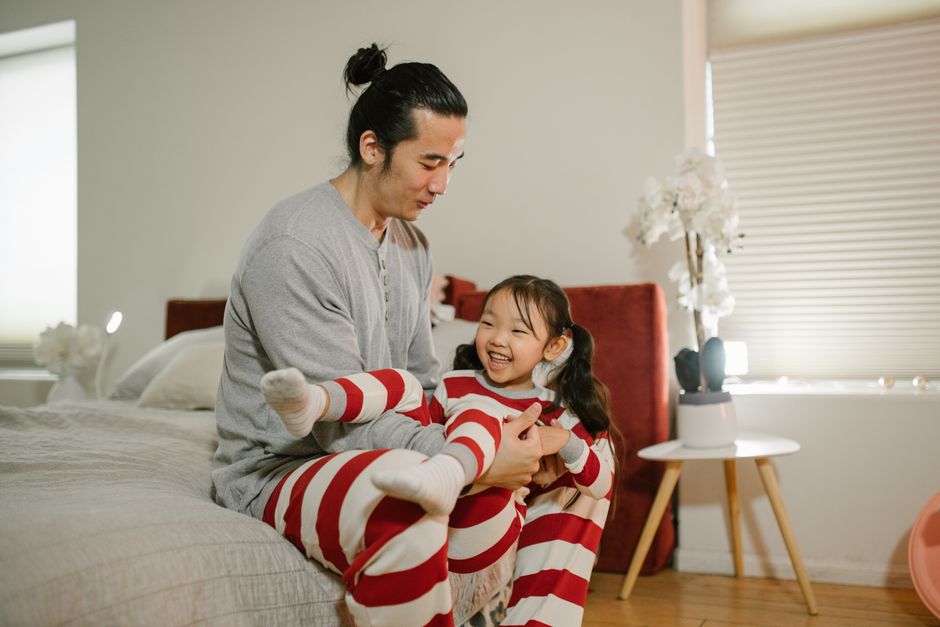 Photo by RDNE Stock project on Pexels A joyful moment captured between a father and daughter playing in a cozy bedroom setting. - Photo by RDNE Stock project on Pexels