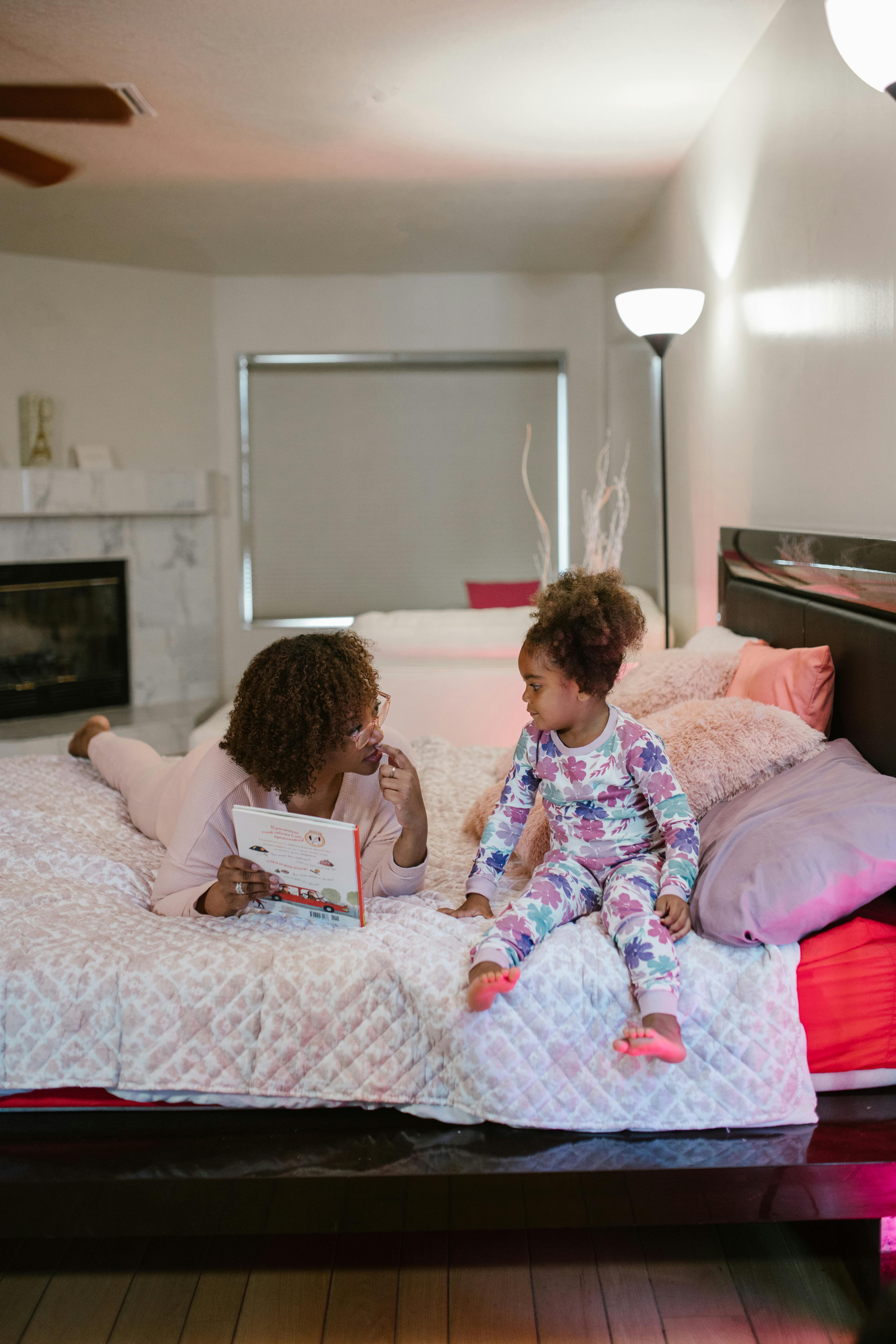 mother with daughter during bedtime