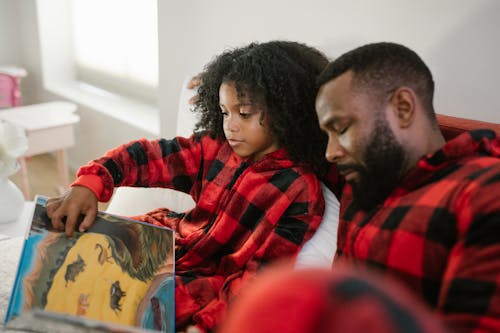 Free Reading Book in Bed Stock Photo