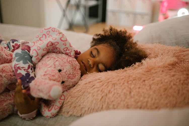 Child Sleeping With Toy