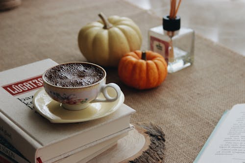 A Cup of Coffee on Top of the Books