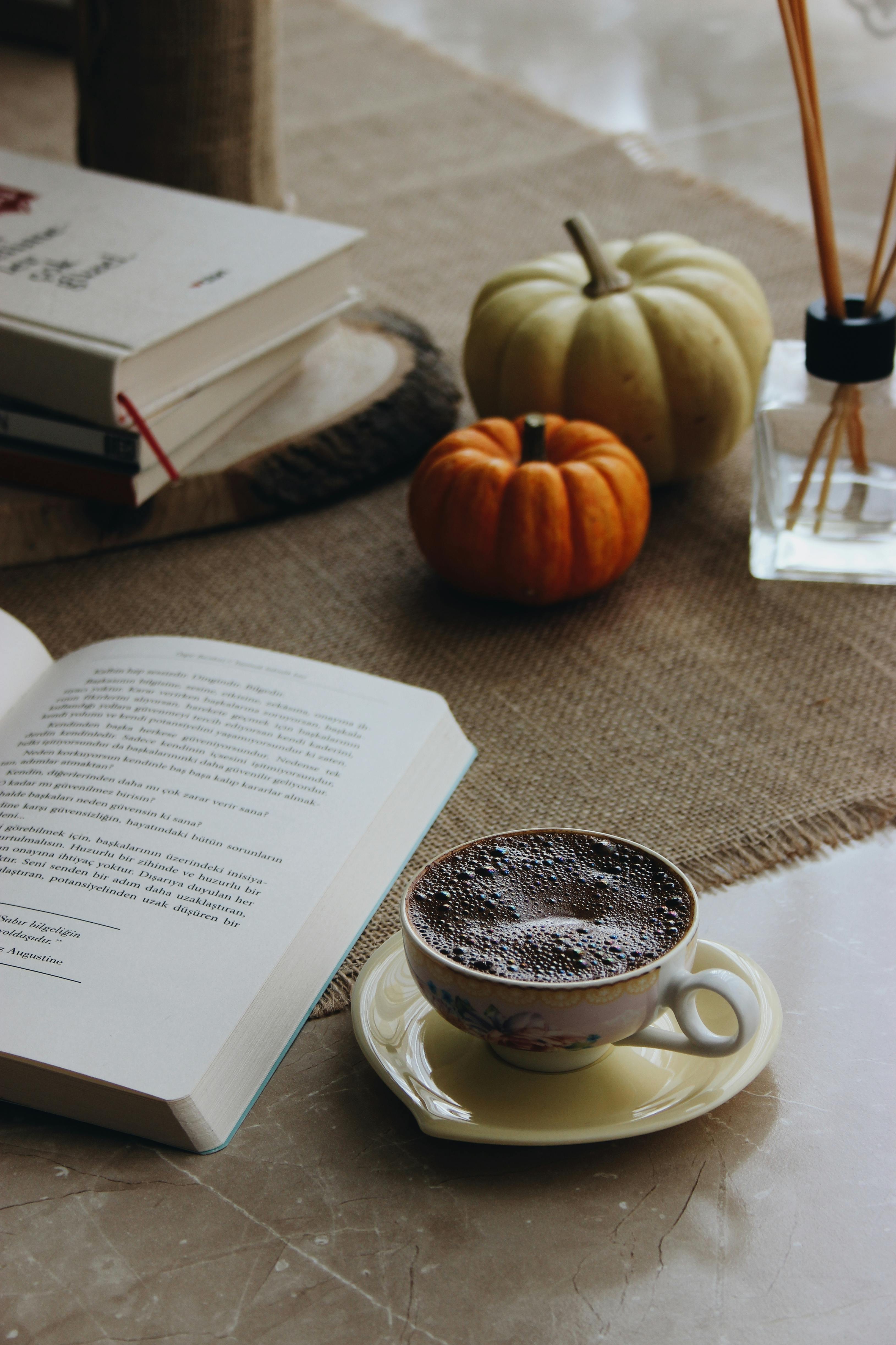 Premium Photo  Workplace with coffee cup, spinner and book