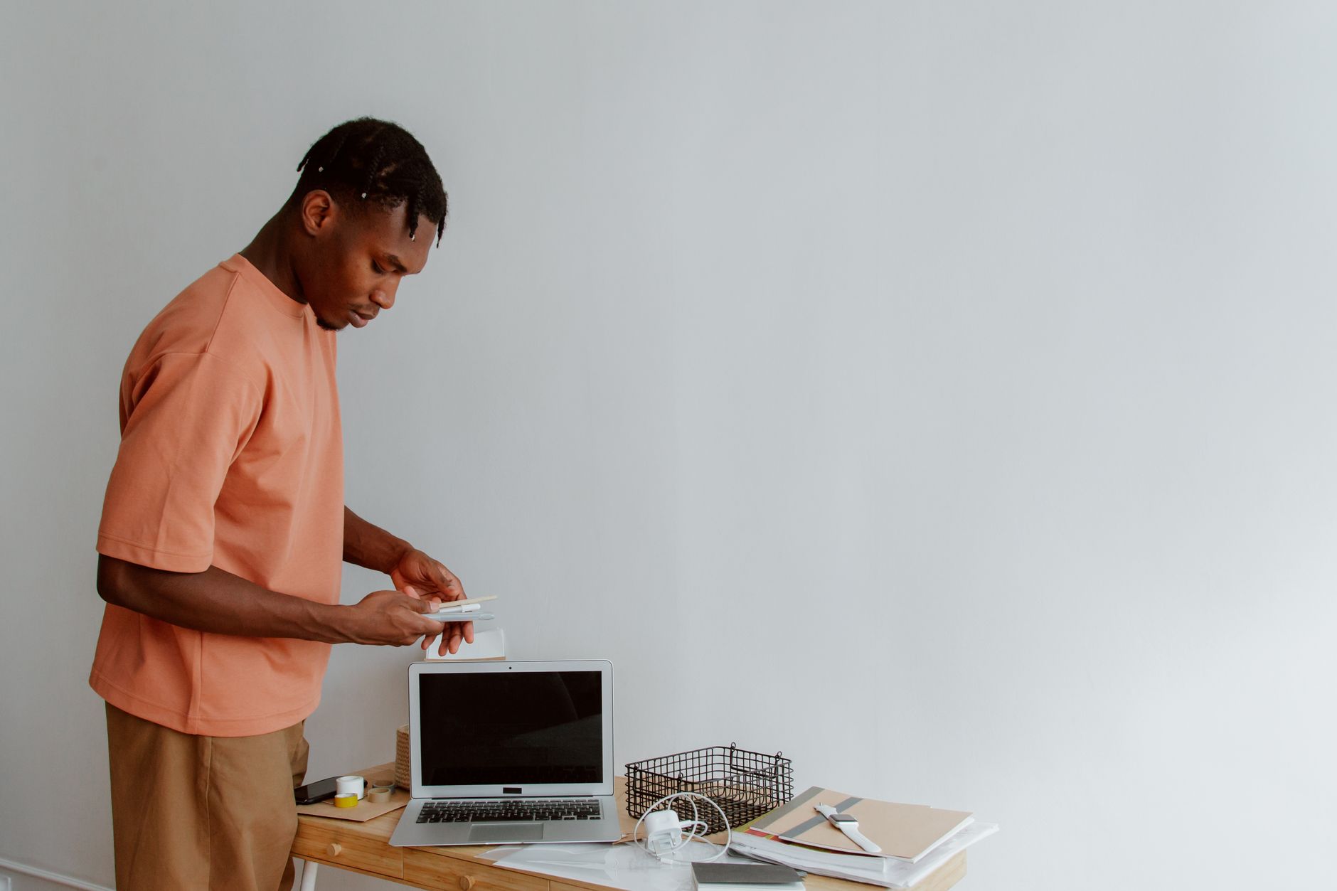 marketing professional working on campaign optimization at standing desk
