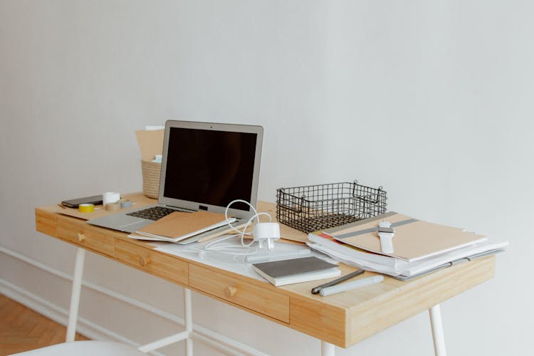 Desk With Laptop And Office Supplies