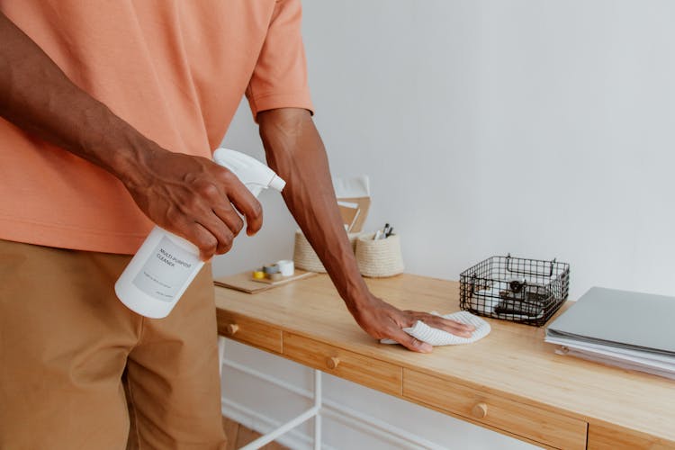 Man Cleaning Desk