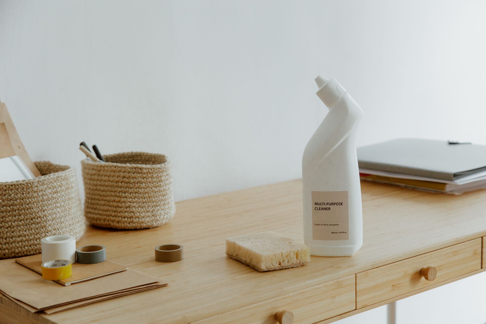 Organized cleaning supplies in baskets — the kind of structure that helps when your brain won't do the organizing for you