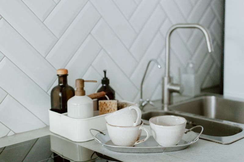 Clean, minimal kitchen counter with tidy storage and a few essentials