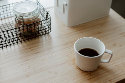 Free Coffee Cup, Jar and Boxes on Table Stock Photo