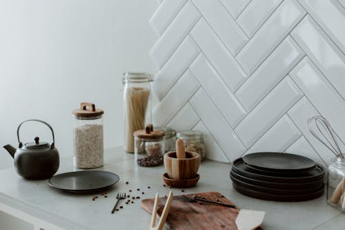 Free Plates, Cutting Board, Jars and Coffee Beans on Kitchen Counter Stock Photo