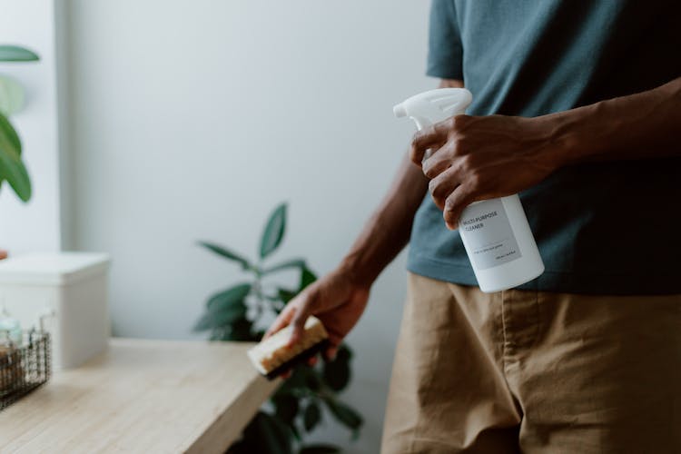 Man Cleaning Kitchen Table 