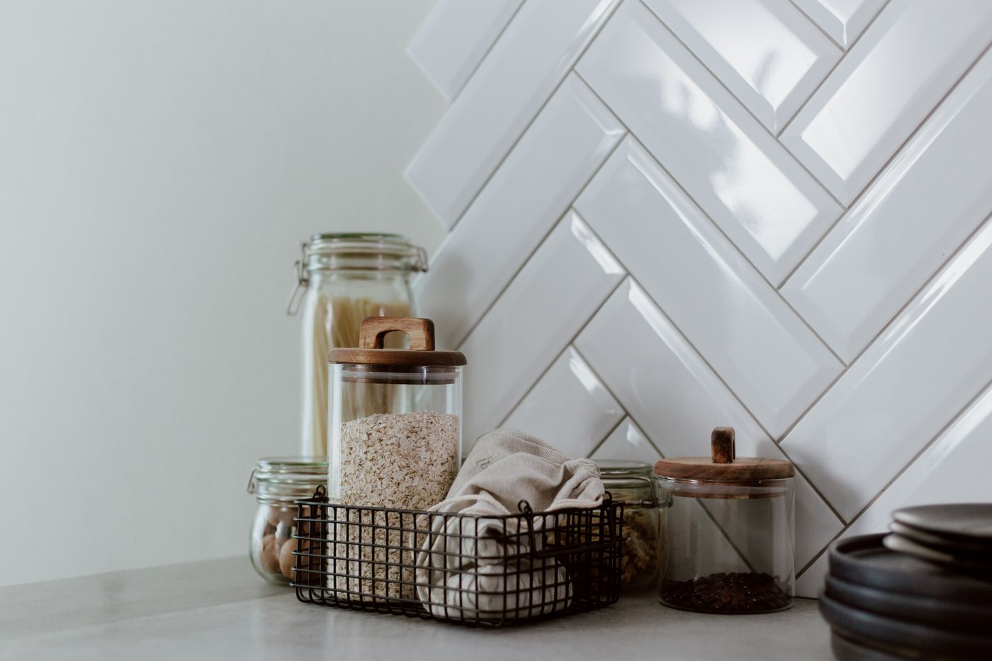 Glass jars with grains and pulses on a kitchen counter