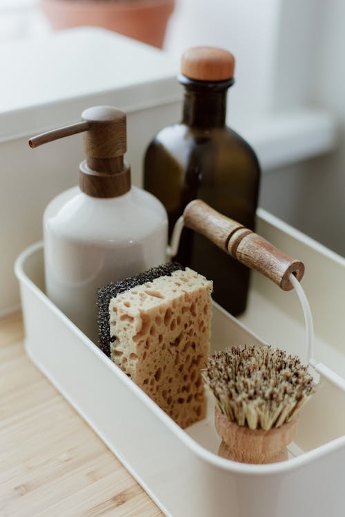 Close-up View of Soap, Sponge, Brush and Glass Bottle