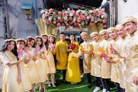 Group of Women in Yellow Dresses Standing on Green Grass Field