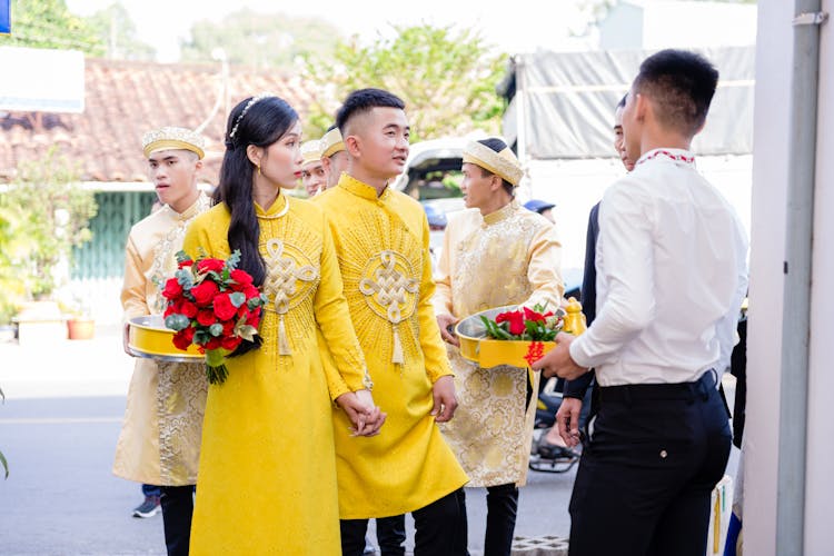 A Newlywed Couple With Their Entourage