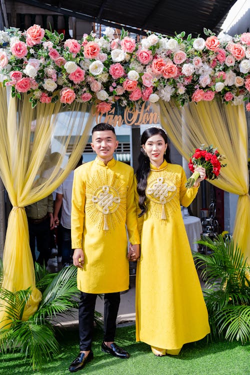 Newlyweds Posing in Traditional Clothing 