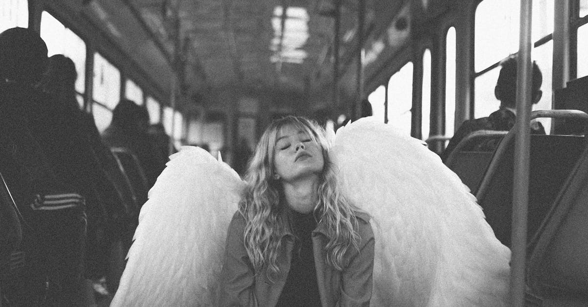 Young Blond Woman Disguised as Angel Kneeling on Bus with Hands Clasped ...